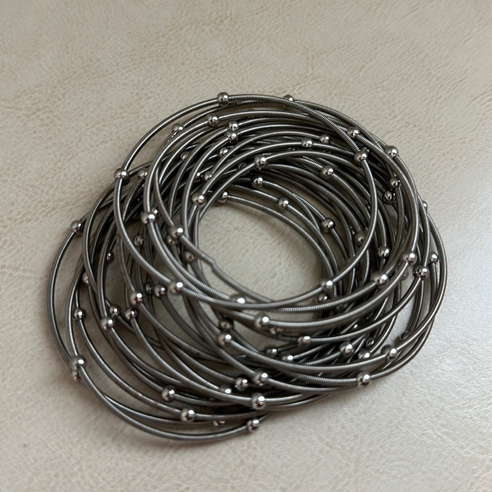 Full set of stretchy, silver bangle bracelets